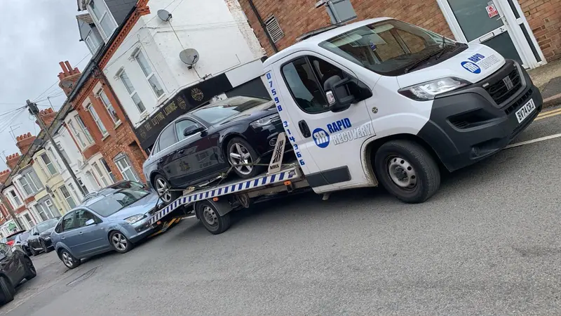 A scrap car loaded on one of our collection trucks in Northamptonshire