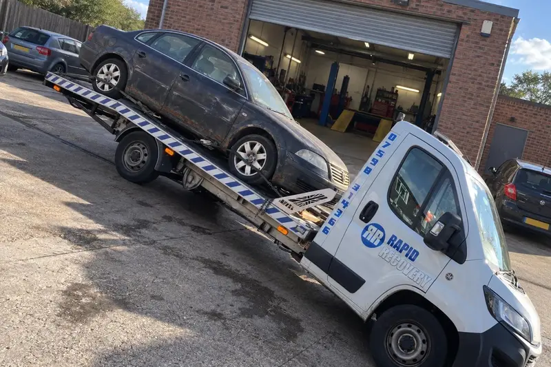 A scrap car loaded on one of our collection trucks near Middleton