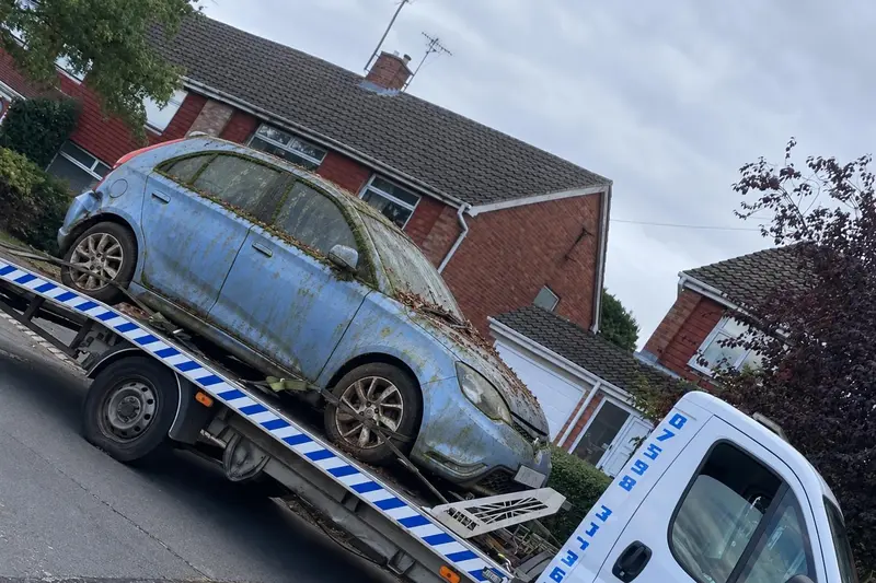 A scrap car loaded on one of our collection trucks in Northamptonshire