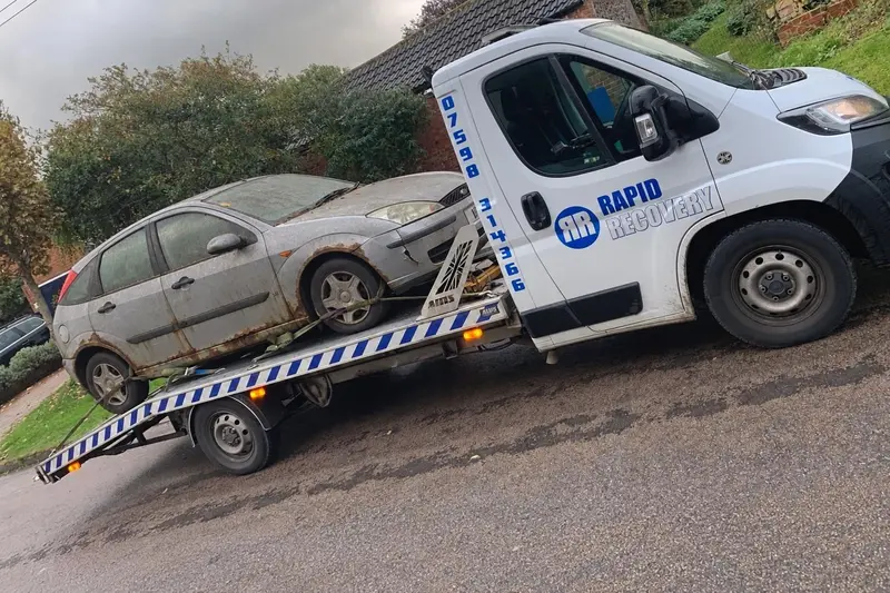 A scrap car loaded on one of our collection trucks near Bulwick