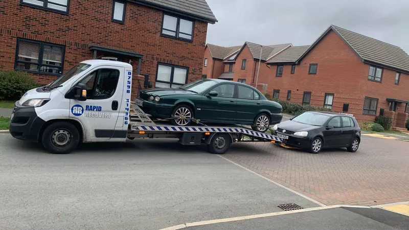A scrap car loaded on one of our collection trucks near Caldecott
